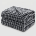 Plaid in pile corallo testurizzato per divano e letto